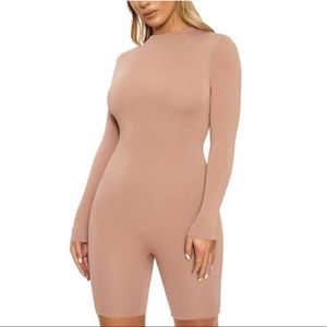 Naked wardrobe romper size small